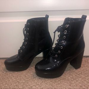 Black platform booties. Laced and zip up. Worn twice.